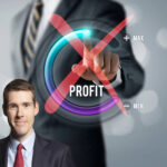 profit dial with a red cross and businessman in background with a picture of matthew Pennycook