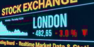A graphic of a screen showing London, stock market falling with a red downward arrow.