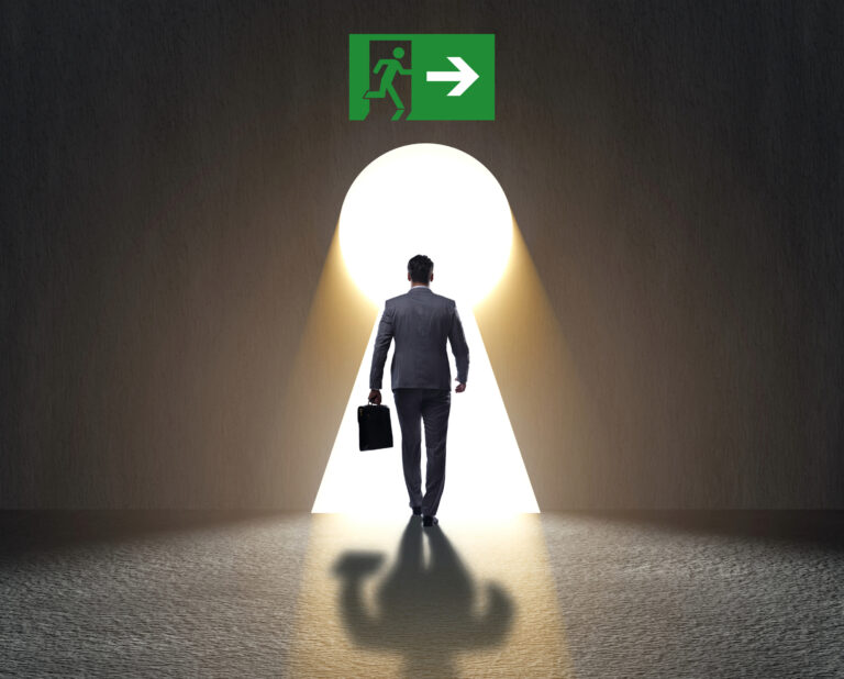 Businessperson walking toward a bright exit symbolizing landlords leaving the rental market