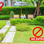 Disputed shared garden area with seating and “no entry” sign