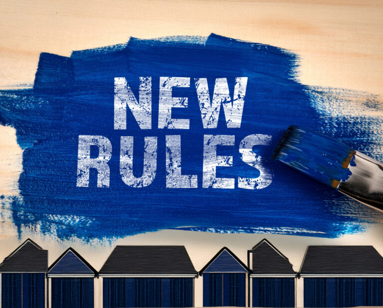 Blue paint with bold text “New Rules” above a row of house silhouettes.