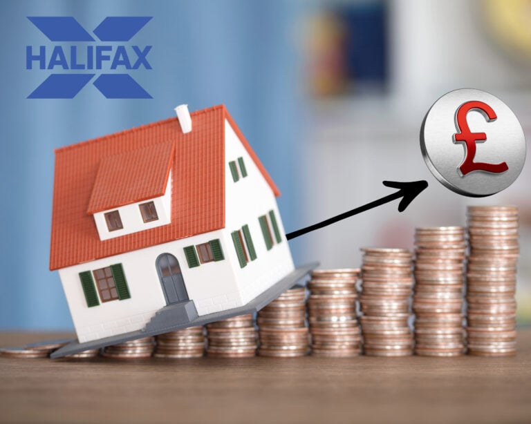Model house on stacked coins with Halifax logo symbolising rising UK house prices.
