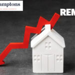 Red arrow showing rent price drop above a white house model with Hamptons branding