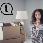 Student looking uncertain while surrounded by moving boxes, symbolizing confusion about renting at university