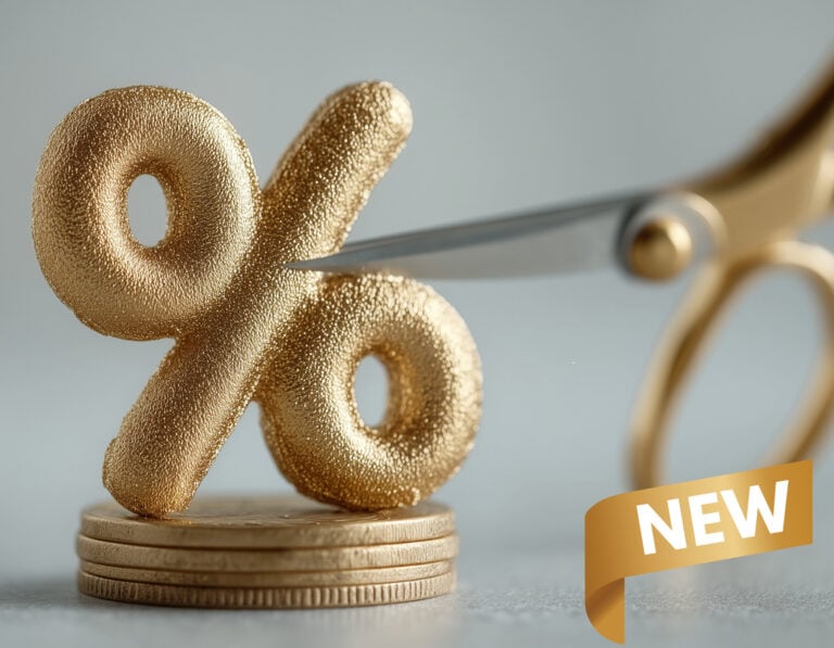 Golden percentage symbol being cut by scissors, symbolizing new mortgage rate reductions.