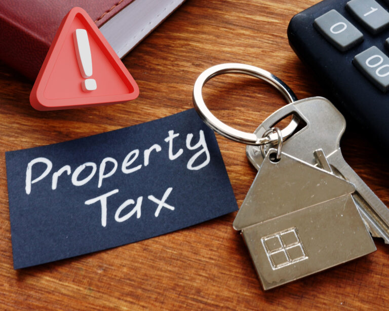 House key with property tax note and calculator symbolizing potential UK property tax changes