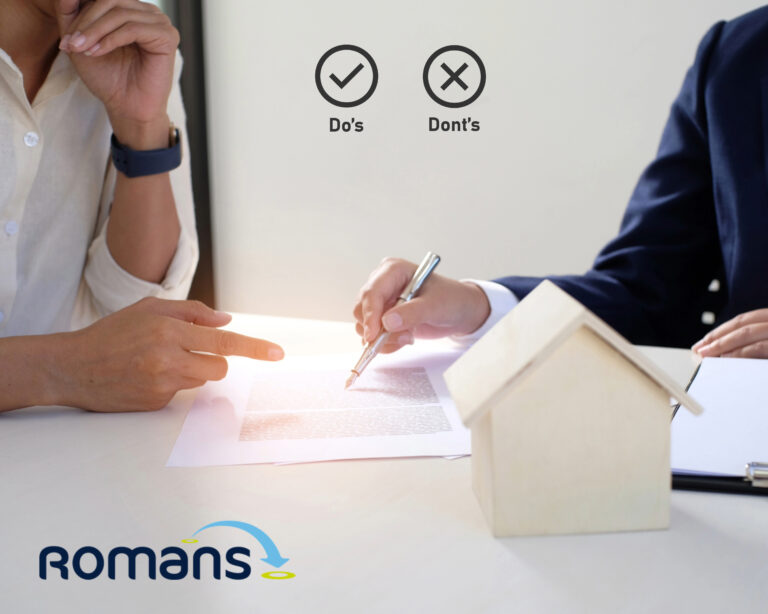 Landlord and agent reviewing property documents and discussing rental management options.