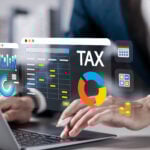 Digital tax on a laptop and a businessman