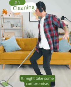 Student listening to music while cleaning living room with mop