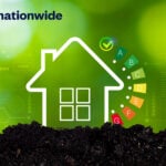 Illustration of a house with energy efficiency rating scale highlighting sustainable housing progress