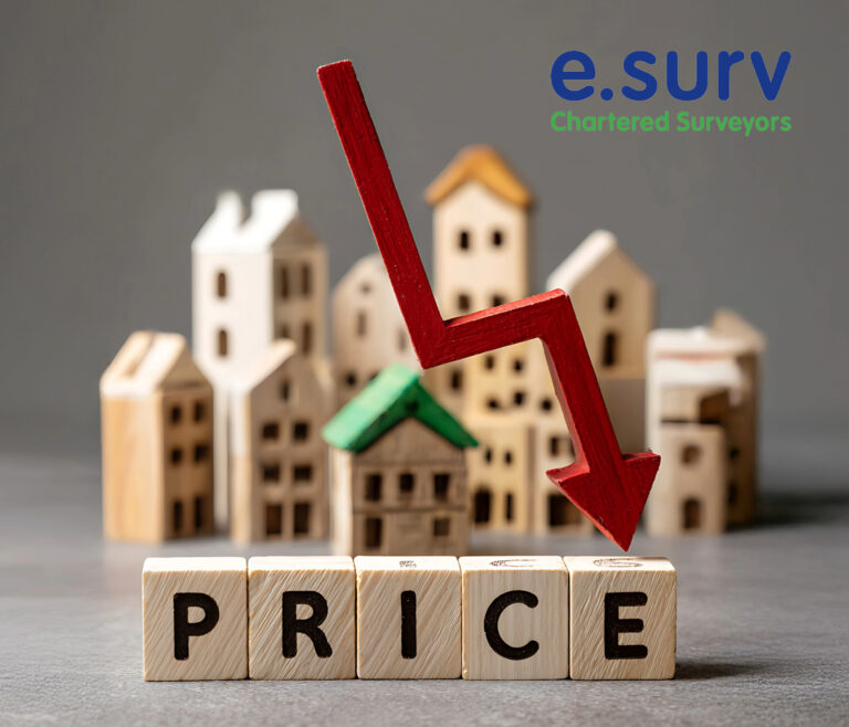 Red downward arrow over wooden houses symbolising falling UK house prices.