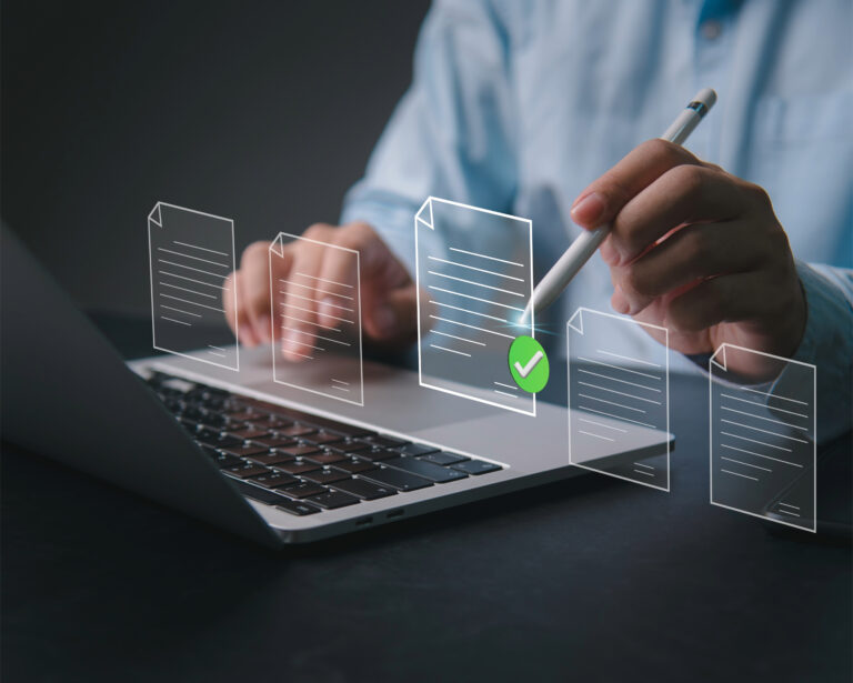 Person using laptop with digital rental documents and approval checkmark