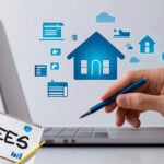 Hand using laptop with housing icons and fees concept, symbolizing landlord registration costs.