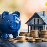 Blue piggy bank and house model with coin stacks symbolizing landlord deposit disputes