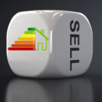 Energy efficiency rating chart on a dice with the word "SELL," symbolizing landlord concerns over EPC rules.