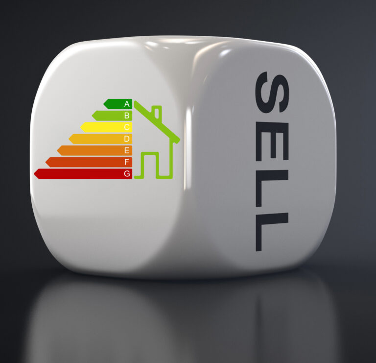 Energy efficiency rating chart on a dice with the word "SELL," symbolizing landlord concerns over EPC rules.