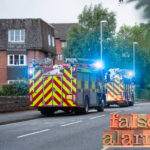 Fire engines respond to a false alarm at a block of flats in England