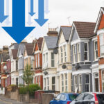 Row of terraced houses with large blue arrows symbolising decline in HMO availability