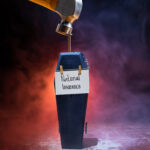 Coffin marked National Insurance with a hammer poised above, symbolising threat to landlords.