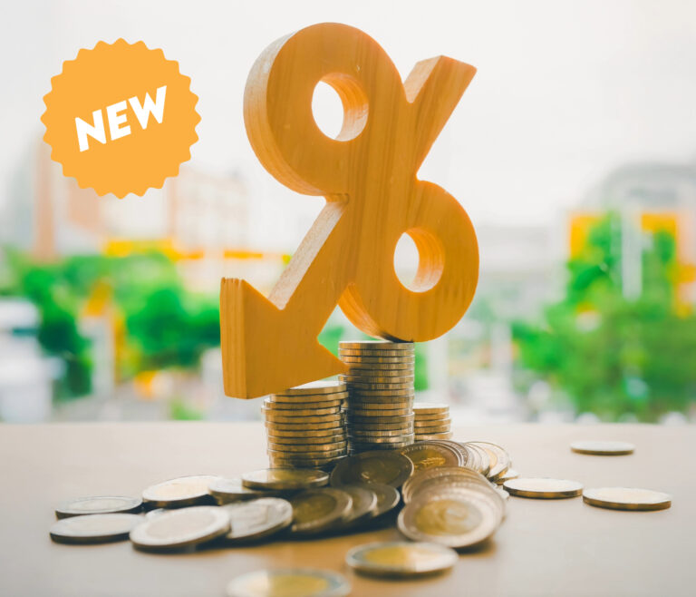 Stacked coins with a wooden percent symbol representing new buy to let mortgage changes