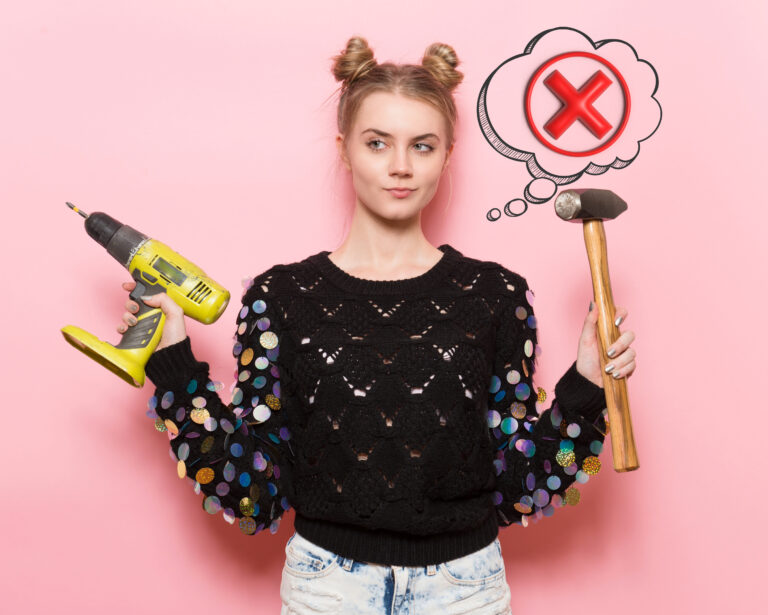 Student holding drill and hammer, choosing the right tool for home maintenance