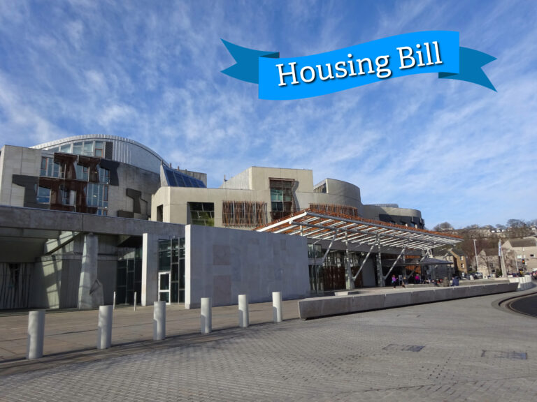 Scottish Parliament building with Housing Bill banner in sky