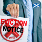 Scottish eviction notice with ban symbol highlighting proposed housing bill amendment.