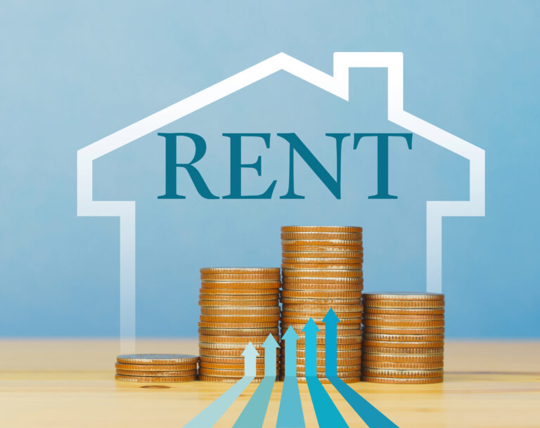 Stacked coins with rising arrows symbolizing increasing UK rental costs