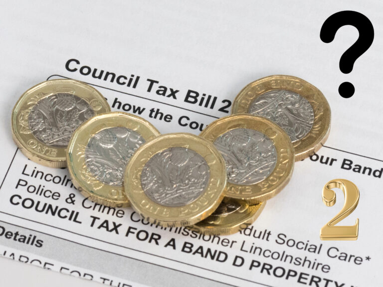 Pound coins on a council tax bill highlighting new second home charge.