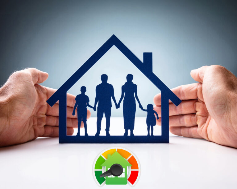 Hands shielding a paper-cut family inside a house with an energy efficiency gauge below.