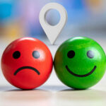 Red and green smiley faces showing contrast in tenant satisfaction across UK regions