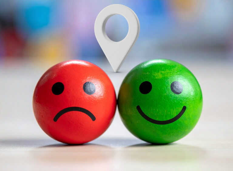 Red and green smiley faces showing contrast in tenant satisfaction across UK regions
