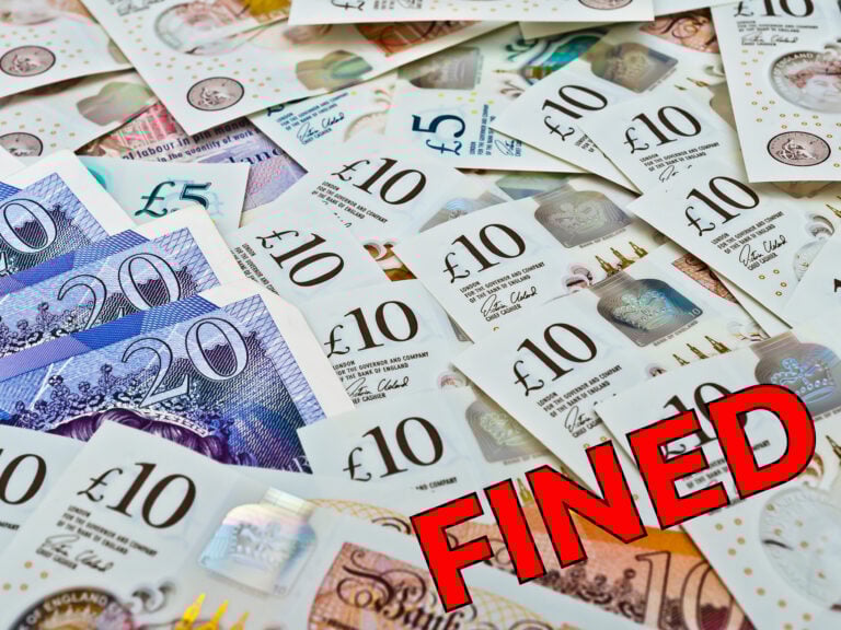 Pile of British pound notes with the word “FINED” symbolising landlord penalties in Hounslow.