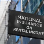 Sign showing “National Insurance on rental income” outside office buildings.