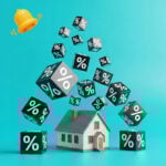 House surrounded by floating percentage cubes symbolizing mortgage rate reductions