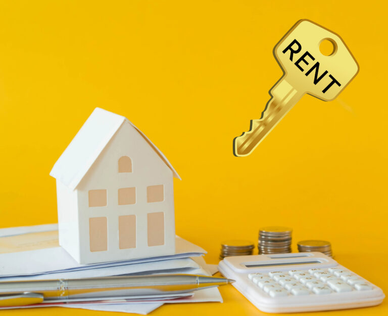 Model house, coins, and calculator symbolizing rising rental values and property market trends.