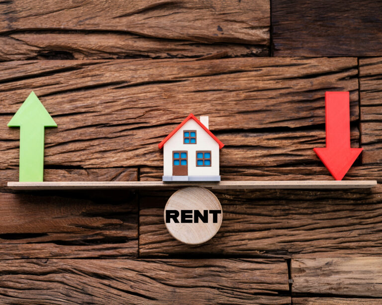 Model house balancing between rising and falling rent prices.