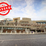 Scottish Parliament building with "PASSED" stamp marking approval of Housing Bill