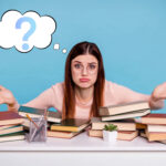 Confused student surrounded by books, symbolizing uncertainty about the Renters' Rights Bill.