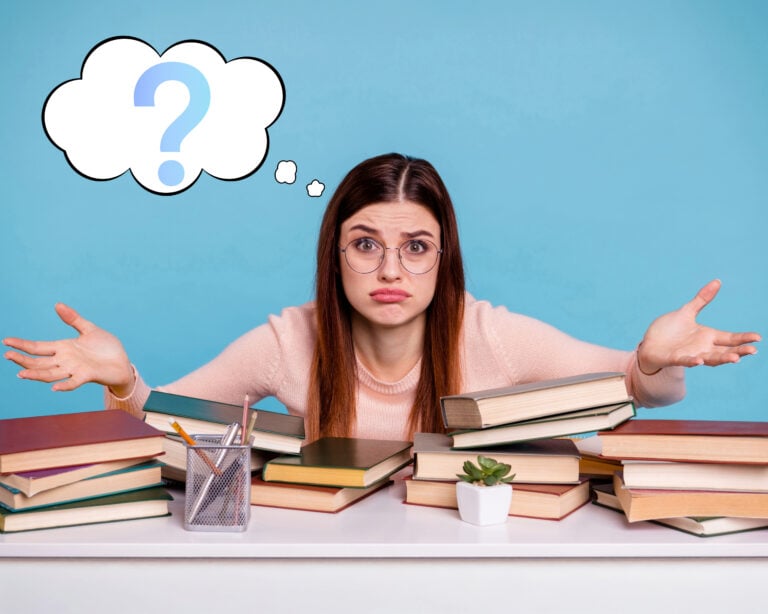 Confused student surrounded by books, symbolizing uncertainty about the Renters' Rights Bill.
