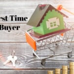 Model house in a shopping cart with coins and keys, symbolizing first-time homebuyer reforms