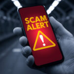 Scam alert warning on phone highlighting property fraud risks for landlords