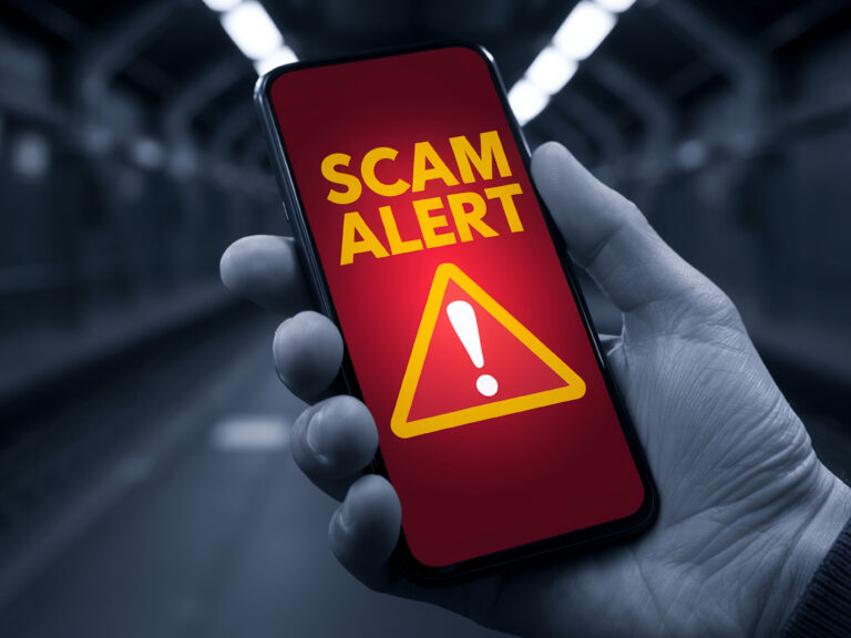 Scam alert warning on phone highlighting property fraud risks for landlords