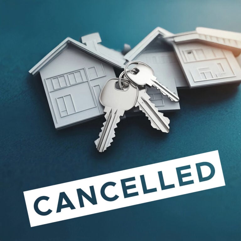 House keys on paper house models with “Cancelled” text, symbolising end of housing deal or policy reversal.