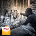 Hooded person spray-painting graffiti on a wall alongside an eviction notice graphic, illustrating anti-social behaviour in tenancy cases