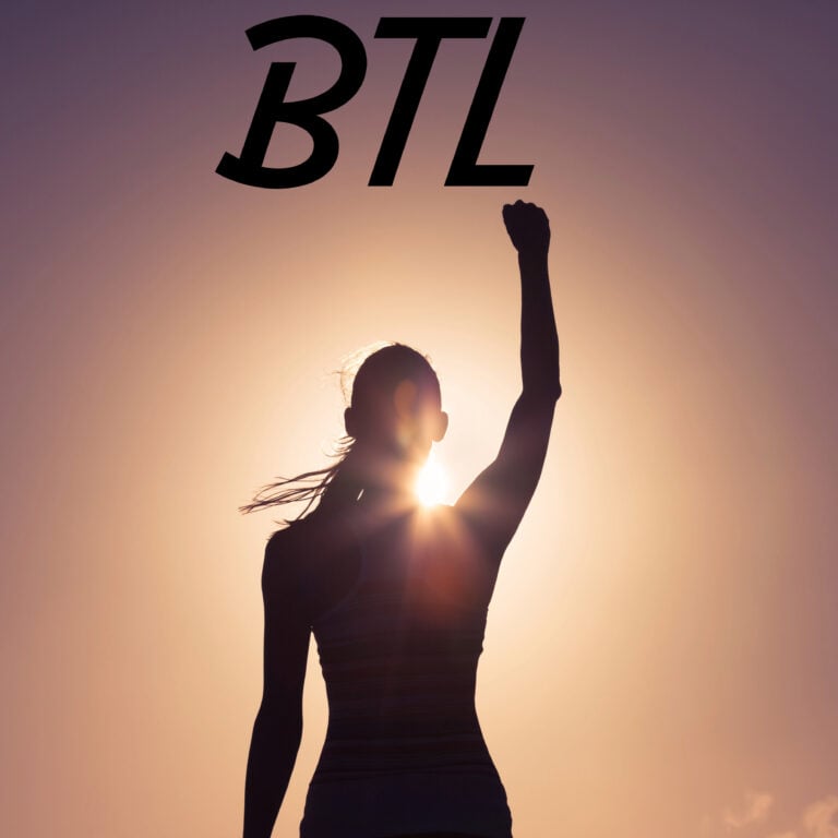 Confident landlord raising arm in triumph against sunrise, symbolising renewed optimism in the buy-to-let market.