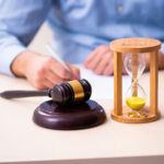 Gavel and hourglass symbolising court delays in landlord possession cases