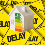 House model with EPC rating graphic set against multiple delay signs, highlighting stalled energy-efficiency upgrades