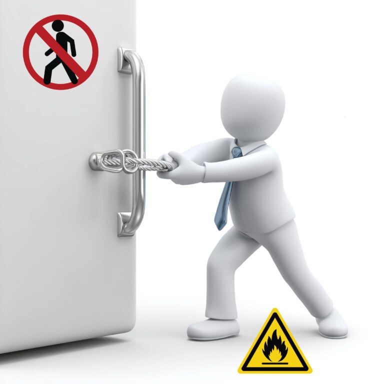 Figure securing a locked door with warning signs for restricted access and fire hazard