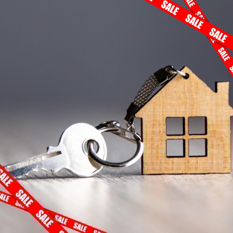 House key and wooden home keychain symbolising landlords selling properties amid new rental laws